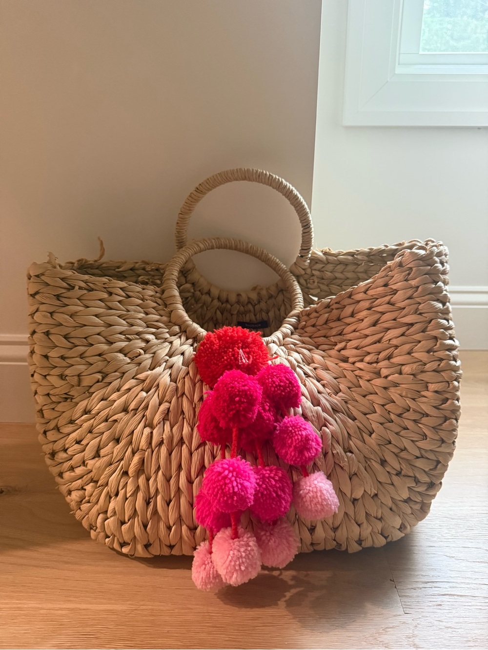 Woven Straw Tote with Pink & Red Pom Pom Accent